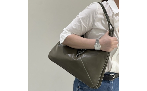 Vegetable - tanned sheepskin under - arm bag