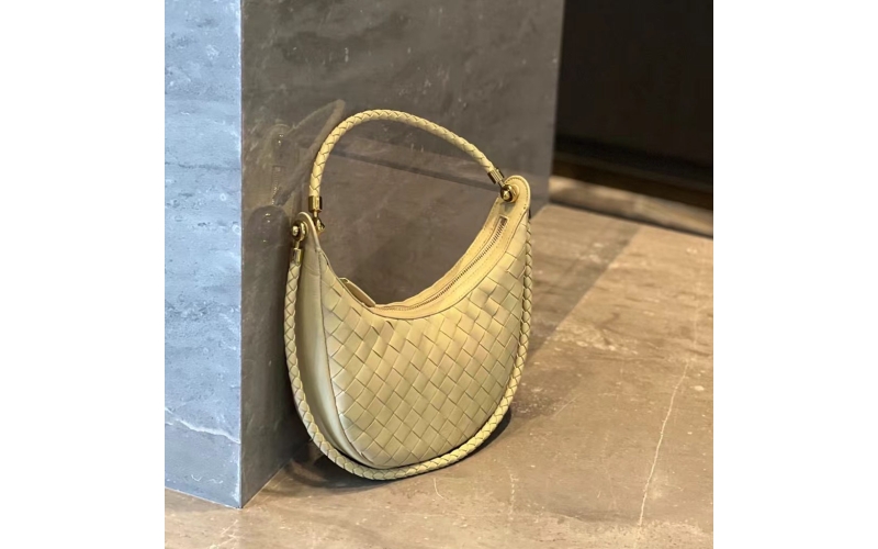 Woven crescent - shaped bag